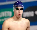 Nuotatore Alessandro Ragaini con cuffia e occhialini, pronto a gareggiare.