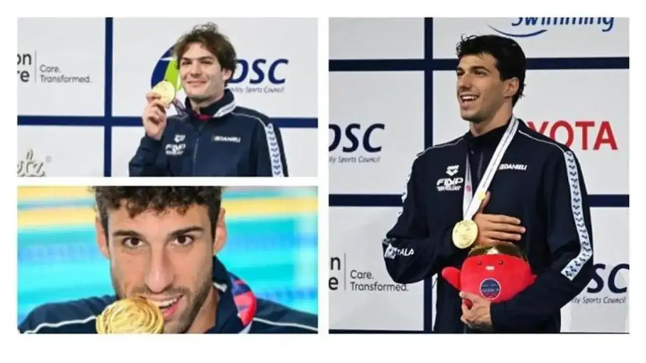 Pasquale Giordano, nuotatore italiano, festeggia una medaglia d'oro con un sorriso e un peluche rosso.